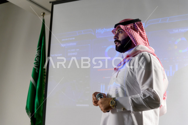 Close-up picture of a Saudi businessman, a speaker and a participant in the businessmen and companies training course, business development and partnerships, a business meeting, training course, employee meeting, university lecture