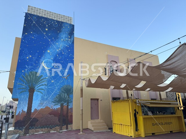 Old clay installations and buildings, heritage and traditional Saudi Arab Islamic civilization, historical, cultural and artistic landmarks, street murals, walking on the hand-painted carpet in the streets and roads of the new neighborhood in the town of Al-Ula, the most prominent international tourist villages.