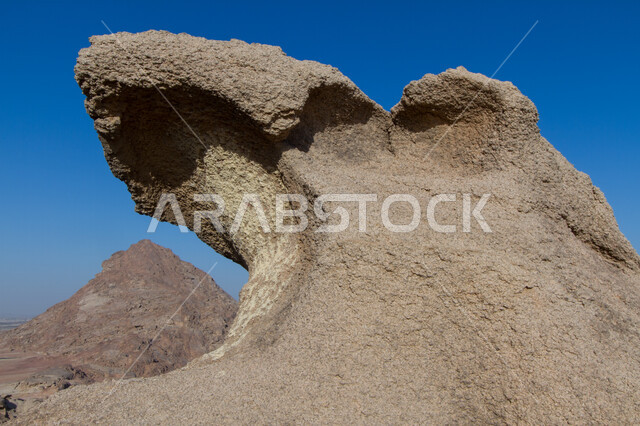 Rock formations in archaeological tourist areas, empty gaps, caves and ground cavities, a close-up of the shapes of the stones of Prince Ahmed Cave in the city of Al-Ruwaydah in Al-Quwayyah Governorate, west of Riyadh, the mountainous nature and terrain in the Kingdom of Saudi Arabia