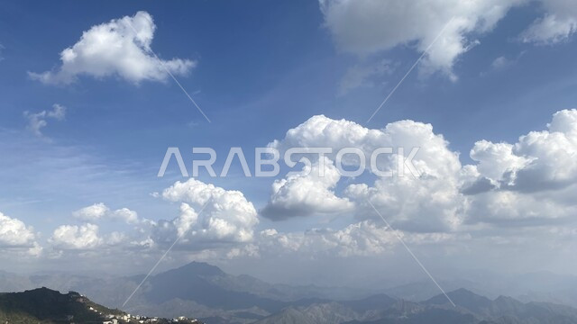 Relaxing and enjoying the tranquil nature, the cloudy sky, a close-up of the Faifa Mountains in the south of the Kingdom, the distinctive landscapes of Saudi Arabia, tourist mountainous places in the Jazan region, the foggy atmosphere in the mountain highlands, areas that attract and attract tourists