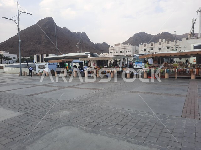 Nobility, authenticity and Saudi heritage, buying and selling traditional goods in Uhud Square in Medina, popular markets in the Kingdom of Saudi Arabia, famous landmarks and attractions, areas of mountain peaks and heights, tourism in Islamic places in the holy cities during the daytime