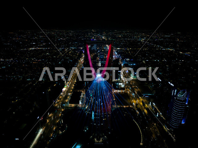 An artistic journey for creative light transformation, the Saudi Noor Festival, enjoying the forms of light arts, the seasonal Riyadh Art Program initiative, fun entertainment activities and events to attract tourists from abroad, annual events and celebrations, a picture from above of the colorful lighting shows on the Kingdom Tower