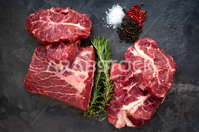 A collection of fresh red raw meat ready to cook, various livestock meats in the meat shop, fresh animal food and different types of meat, and delicious food recipes.
