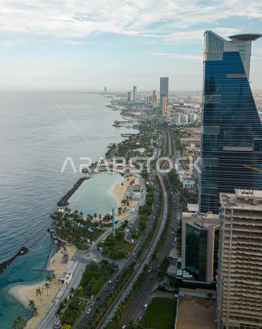Residential and commercial facilities and buildings on the waterfront, urban growth and development of towers in Jeddah, famous tourist attractions and areas in Saudi Arabia, interest in afforestation and planting green plants in coastal cities.