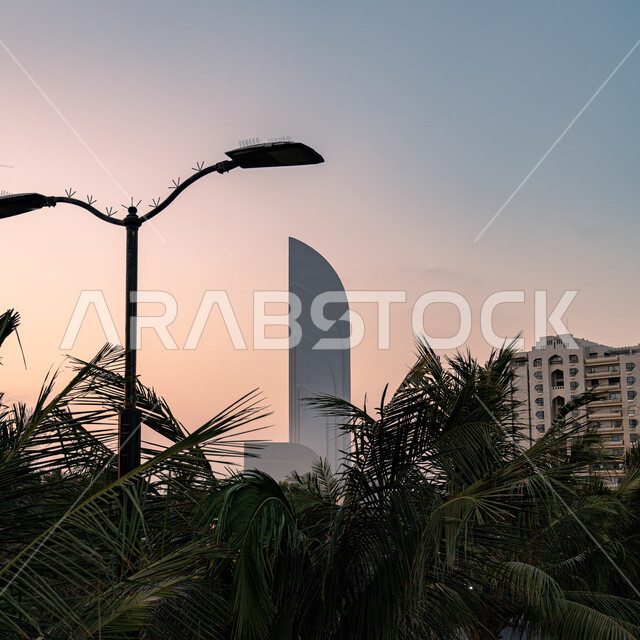 Growth and urban development of towers in Jeddah, famous tourist attractions and areas in Saudi Arabia, residential facilities and buildings on the waterfront, interest in afforestation and planting green plants in coastal cities.