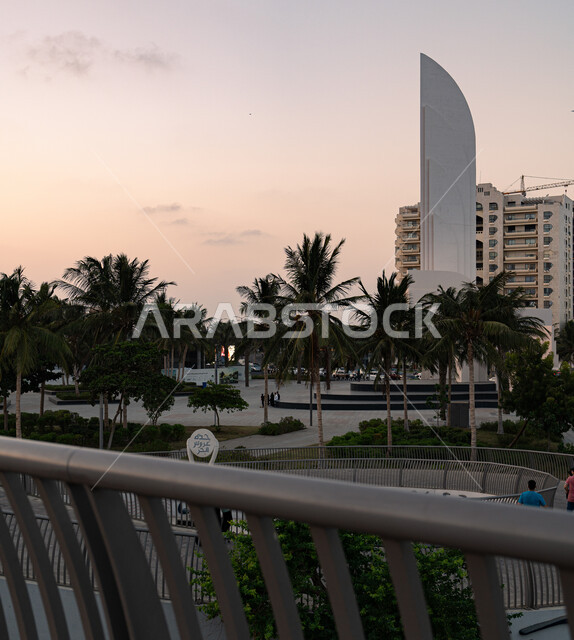 Growth and urban development of towers in Jeddah, famous tourist attractions and areas in Saudi Arabia, residential facilities and buildings on the waterfront, interest in afforestation and planting green plants in coastal cities.