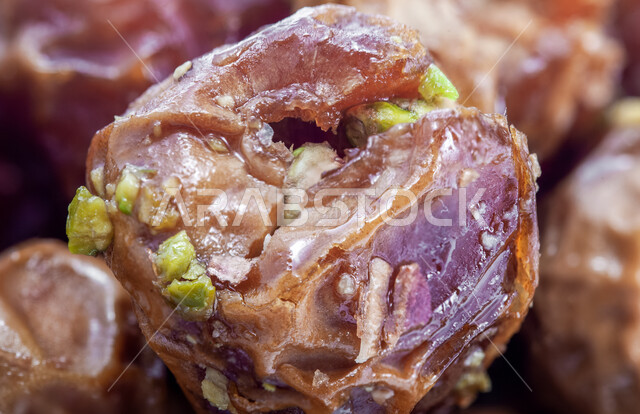 A highly important nutritional meal, national Saudi local products, healthy and beneficial food, different types of delicious healthy dates, a close-up of dates stuffed with nuts, delicious Ramadan hospitality.