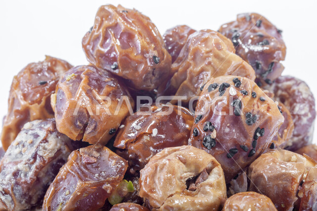 A highly important nutritional meal, national Saudi local products, healthy and beneficial food, different types of delicious healthy dates, a close-up of dates stuffed with nuts, delicious Ramadan hospitality.