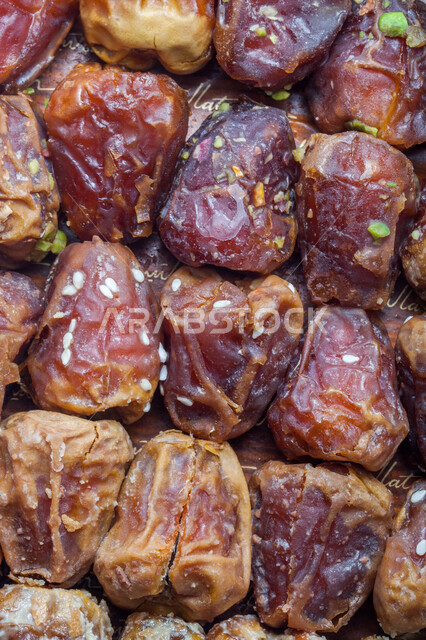 A highly important nutritional meal, national Saudi local products, healthy and beneficial food, different types of delicious healthy dates, a close-up of dates stuffed with nuts, delicious Ramadan hospitality.