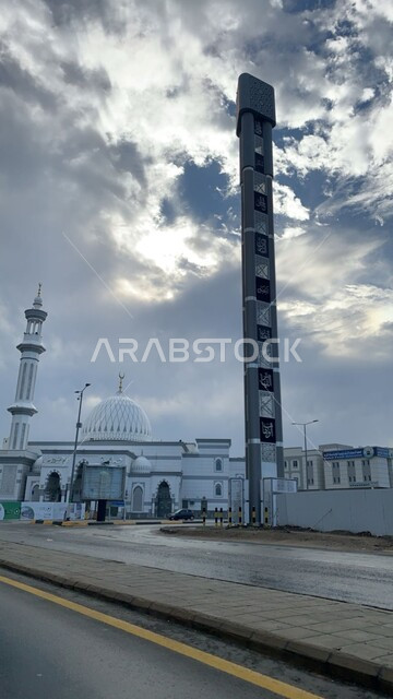 Al-Ihsan Mosque in the Third Ring Road in Mecca, famous sacred Islamic religious landmarks and places, worship and closeness to God Almighty, architectural designs in the ancient Islamic style, view of the cloudy sky