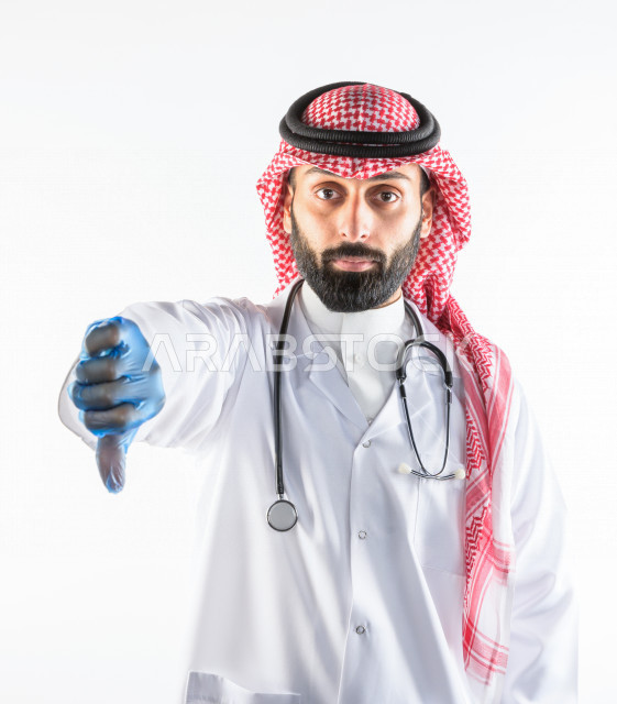 Portrait of a Saudi Gulf doctor smiling and looking at the camera, providing his services to patients efficiently, white background, medical and healthcare concept