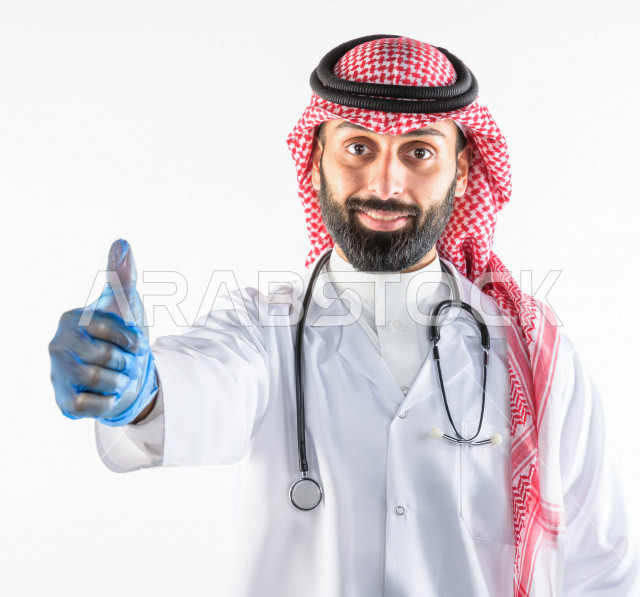 Portrait of a Saudi Gulf doctor smiling and looking at the camera, providing his services to patients efficiently, white background, medical and healthcare concept
