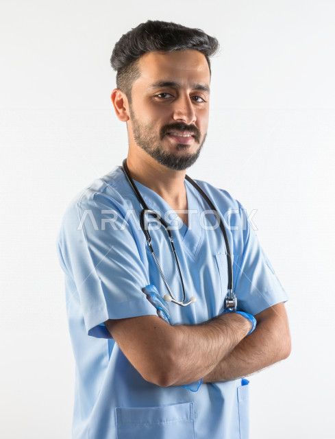 Portrait of a Saudi Gulf doctor smiling and looking at the camera, providing his services to patients efficiently, white background, medical and healthcare concept