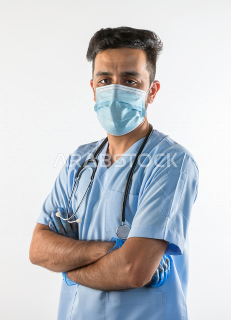 A Saudi doctor wears a muzzle, follows safety procedures, provides his services to patients efficiently, a white background, the concept of medicine and health care