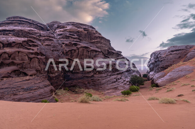 Mountains, formations and rock formations in the Tabuk region, skies full of clouds in the famous tourist places in the Kingdom of Saudi Arabia, desert natural reserves, desert areas and sand dunes in the prairies, ancient historical monuments.