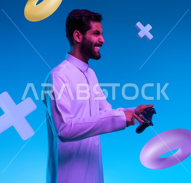 تجربة ترفيهية ممتعة في الألعاب الالكترونية والأجهزة الحديثة، العالم الرقمي الترفيهي، المتعة والتسلية بالفيديو جيمز، صورة من الجانب لشاب عربي خليجي سعودي يرتدي الثوب التقليدي يقوم بالنقر على عصا التحكم بإيماءات التفاعل والاندماج والحماس، خلفية أيقونات أزرار التنقل