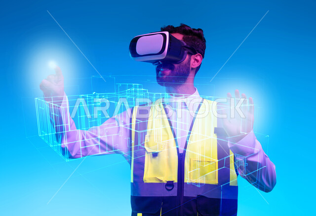 العمل بالقطاع الهندسي عبر تقنية الواقع الافتراضي، التفاعل مع الهندسة الافتراضية، بورتريه مقرب لمهندس عربي خليجي سعودي يرتدي سترة العمل ونظارة الفي آر يتفاعل مع مجسم لمخطط بناء هولوجرامي ، رؤية مستقبلية سعودية 2030، نمو المجال الهندسي التكنولوجي، خلفية زرقاء