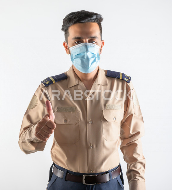 Portrait of a Saudi Arabian Gulf man working as a security man, wearing uniforms to work, maintaining security and reassurance, guard and safety, white background