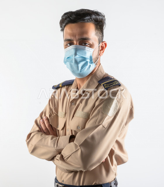 Portrait of a Saudi Arabian Gulf man working as a security man, wearing uniforms to work, maintaining security and reassurance, guard and safety, white background
