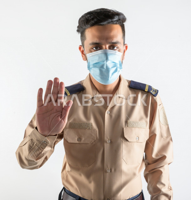 Portrait of a Saudi Arabian Gulf man working as a security man, wearing uniforms to work, maintaining security and reassurance, guard and safety, white background
