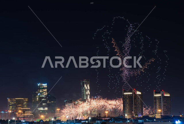 التطور و النمو الاقتصادي للابراج وناطحات السحاب, عروض ثقافية و أنشطه ترفيهية، صورة جوية  للفن الهندسي المعماري على الطراز الحديث، إضاءه أبراج الملك عبد الله المالية في وقت الليل أثناء الاحتفال في مناسبة الفوز في معرض اكسبو 2030 في السعودية