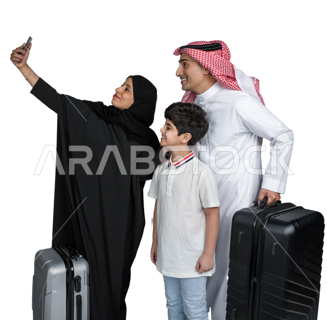 Portrait of a happy Saudi Arabian Gulf family with suitcases, ready to