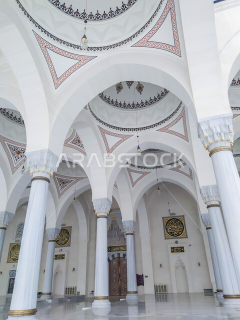 Architectural art and geometric designs for arches and columns in the Arab-Islamic style, the Grand Mosque of Sharjah in the United Arab Emirates, famous religious landmarks in the Emirate of Sharjah, worship and getting closer to God, Islamic background
