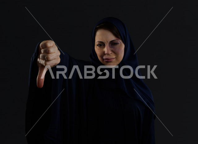 Expressions and emoticons of the face and hands of a Saudi woman subjected to physical violence, stop violence against women, end violence against women, November 25, International Day for the Elimination of Violence Against Women, physical bruising