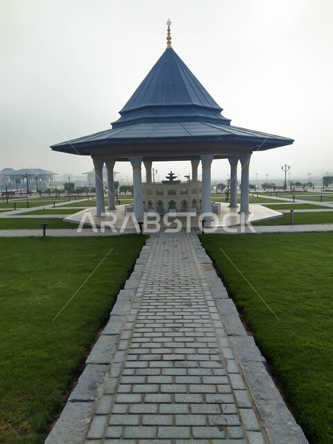 The place designated for ablution in front of the Grand Mosque of Sharjah in the United Arab Emirates, the concept of purity and preparation for prayer, architectural art and decoration in the Arab-Islamic style, famous religious landmarks in the Emirate of Sharjah, attention to the external garden surrounding the mosques.