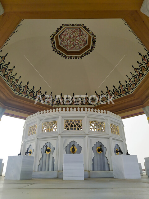 Worship and getting closer to God, architectural art and decoration in the Arab-Islamic style, famous religious landmarks in the Emirate of Sharjah, a close-up of the outdoor place in front of the Sharjah Grand Mosque in the United Arab Emirates, interest in the general landscape surrounding the mosques