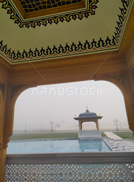 Worship and drawing closer to God, a close-up of a water pool in front of the Grand Mosque of Sharjah in the United Arab Emirates, architectural art and designs of the external area in the Arab-Islamic style, famous religious landmarks in the Emirate of Sharjah, attention to the general landscape surrounding the mosques
