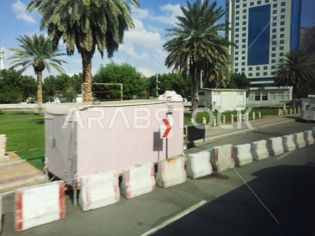 Planting green trees in cities, interest in construction and urban development in Mecca, paved roads and streets in the Kingdom, architectural engineering for buildings, luxury hotels and towers during the day, lifestyle in Saudi Arabia.