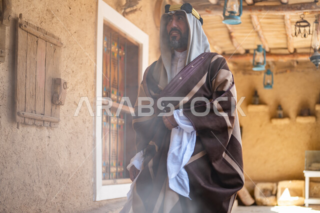 Our Day 1727 AD, Pride and Pride in Saudi Identity, National Occasions and Holidays, a Saudi Gulf Arab Man Wearing the Iqal and Traditional Bisht in an Old Clay House, Wearing Popular Costumes on the Anniversary of the Founding of the First Saudi State, February 22