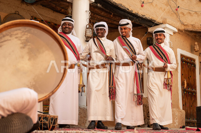 Commemoration of the reunification of the homeland, folk singing, dancing and chants in celebration of Badina Day 1727, performances of traditional folklore groups on national occasions, Saudi Gulf Arab men wearing the popular Najdi parade costumes, celebration of the anniversary of the founding of the Saudi state, February 22.
