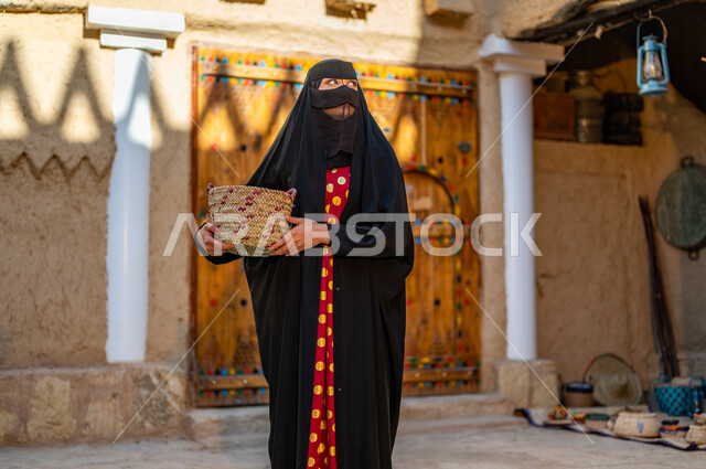 Lifestyle in popular heritage homes, a Saudi Gulf Arab woman wearing a ...