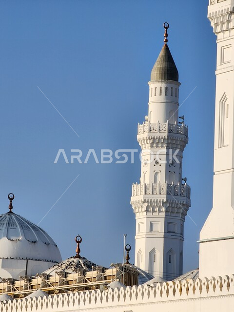 The architectural engineering art of mosques in the Islamic style, inviting Muslims to perform prayers on time, a close-up of the minaret of the Quba Mosque in Medina, worship and getting closer to God, sacred religious monuments in the Kingdom of Saudi Arabia