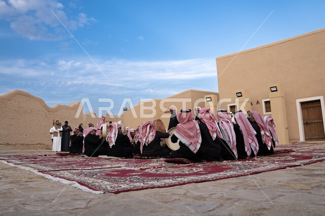 Ancient historical monuments, popular events and celebrations, a back photo of the Ardha band in heritage tourist places in Saudi Arabia, ancient mud buildings and houses in old Diriyah in the city of Riyadh, ancient architectural art of the walls of Salwa Palace in Al-Bujairi in the Al-Turaif district.