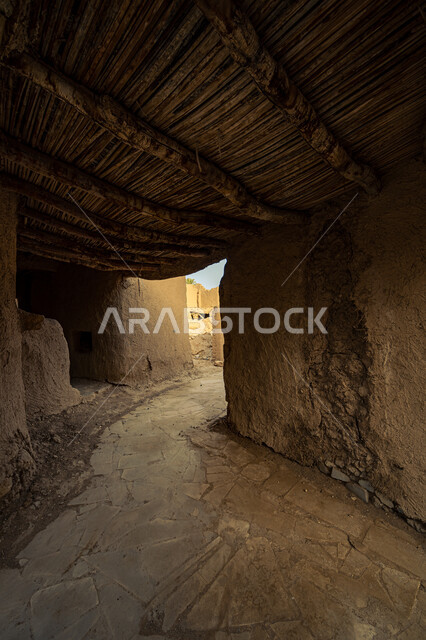 Archaeological historical places, ancient mud heritage buildings in the Kingdom of Saudi Arabia, popular neighborhoods and neighborhoods built in the old style, wooden roofs of old houses and neighborhoods.