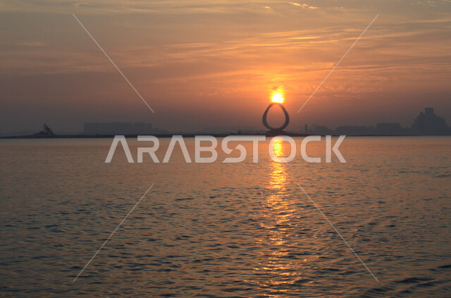 Spending enjoyable times on the shore of the Red Sea, the view of the sunset on the coast of the Arabian Gulf, the natural scenery on the Doha Corniche in Qatar, famous coastal tourist places, nature background