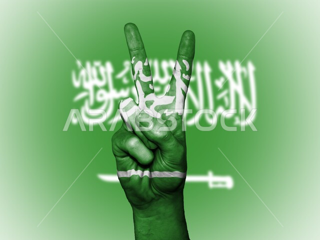 حب الوطن  والاعتزاز به،  صورة مقربه ليد ملونة بالأخضر تمثل علامة السلام والنصر، اندماج الاصابع بكلمة التوحيد في علم المملكه ،  إحياء ذكرى اليوم الوطني السعودي في 23 سبتمبر، يوم العلم 11 مارس, شعار وراية التوحيد والإسلام