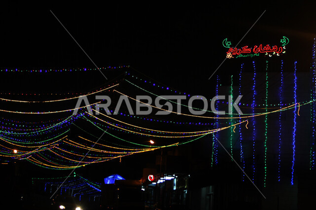 External Ramadan decorations and lights, welcoming the holy month of Ramadan with colored lighting at night, Islamic decorations for religious occasions