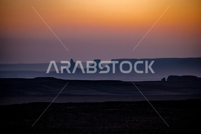 The edge of the end of the world in the Qaddiya in Saudi Arabia, the formations and rock formations, the view of sunset at the highest peaks of Tuwaiq, the fire, the peaks and mountainous heights in the desert areas, historical monuments, tourist places in the Kingdom