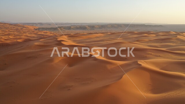 Nafoud Al-Kharara in Riyadh during the day, sand formations in desert natural areas in the Kingdom of Saudi Arabia, dunes and soft golden sand in the Arabian Desert