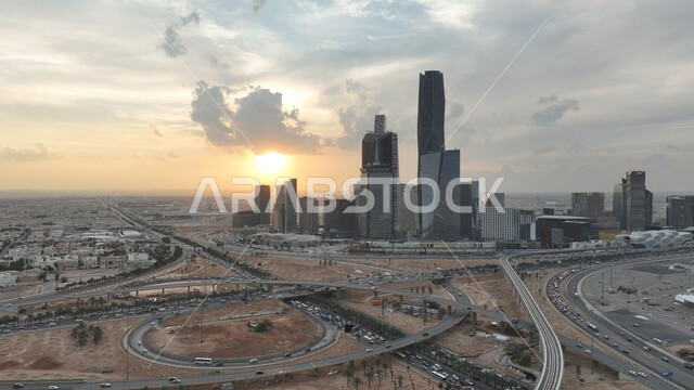 The development of architectural engineering art for buildings and skyscrapers in Riyadh, architectural facilities in the Kingdom of Saudi Arabia, a distinct view of the King Abdullah Financial Center (CAFD) at sunset, interest in tourism areas to attract visitors from all over the world, building a civilized and advanced future
