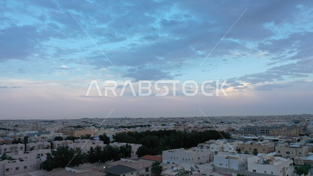 Homes and residential buildings at sunset, interest in the cultivation of trees and plants, an air snapshot of the city of Riyadh, the famous tourist cities and attractions, the progress and development of architecture in the Kingdom of Saudi Arabia
