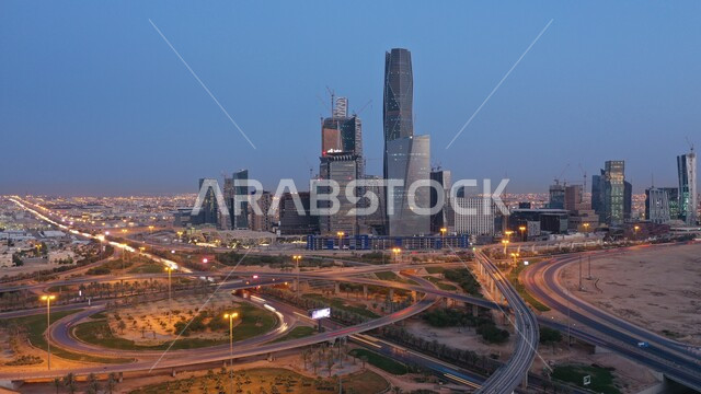Architectural facilities, skyscrapers, financial and economic towers, an aerial photo of the city of Riyadh illuminated by lights at night, traffic in the streets, famous tourist attractions and cities, the King Abdullah Financial Center (KAFD) in the capital, urban growth and progress in the modern style