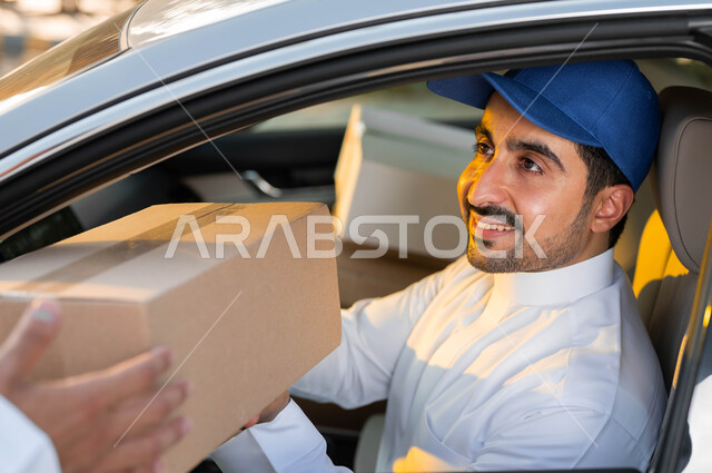 The sales representative delivers the package to the customer, two smiling Saudi Arab men wearing traditional Saudi clothing, one wearing a shemagh and the other wearing a blue sun hat, online shopping in the Kingdom of Saudi Arabia