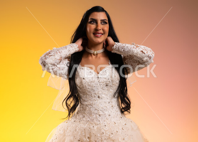 Wedding and marriage ceremonies in Saudi Arabia, attention to elegance and external appearance, a portrait of a Saudi Arabian Gulf bride wearing a white wedding suit, wearing a diamond-studded necklace, gestures of happiness and pleasure, the concept of adornment and a radiant appearance, a colorful background.