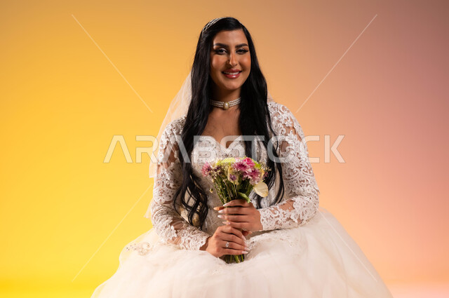 The concept of adornment and a radiant appearance on the wedding day, gestures of joy and happiness on the night of life, distinctive and unique flower bouquets, a portrait of a smiling Saudi Arabian Gulf bride wearing a white wedding dress holding a bouquet of roses in her hand, wedding and marriage ceremonies in Saudi Arabia, a colorful background