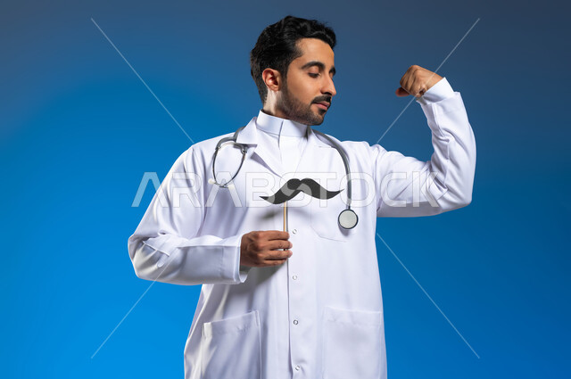 ذكرى اليوم العالمي للرجل 19 نوفمبر، الحفاظ على الصحة الجسدية والقوة العضلية، مهنة الطب والعمل في القطاع الصحي، بورتريه مقرب لطبيب عربي خليجي سعودي يرتدي المعطف الطبي والسماعات الطبية يحمل بيده عود خشبي مع قصاصة ورقية على شكل شارب، خلفية زرقاء